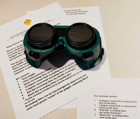 Green goggle over package material exclusively for Salus University Low Vision Rehabilitation Program
